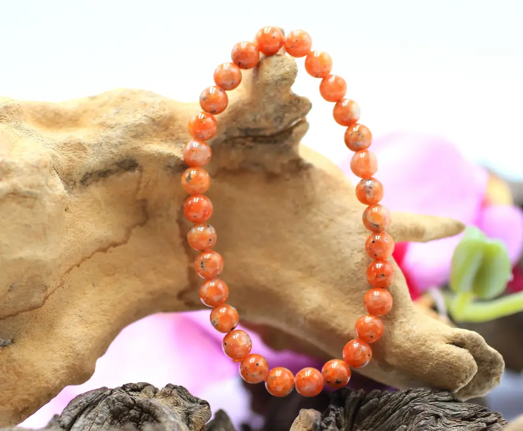 Bracelet en perles 6mm en Calcite rouge
