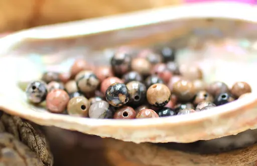 Perle 6mm en Rhodonite noire et rose